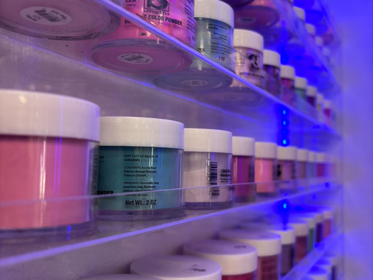 Dip powder colours on the wall at NY Nails Spa
